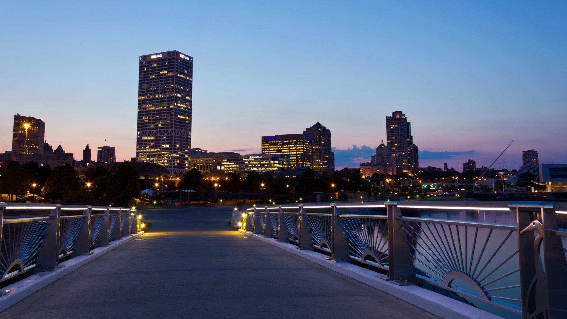 Downtown Milwaukee skyline at blue hour from the lakefront pedestrian bridge